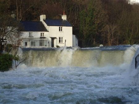 The bridge at the Whitewater Hotel immersed in flood water, sent in by Paul Coulson
of Backbarrow.