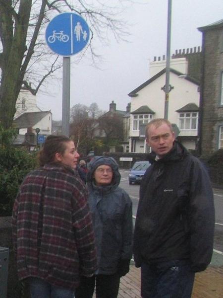 Tim Farron MP (right) with residents in a rainy Kendal, photo sent by kendalcottages.com.