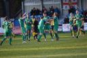 Town players congratulate Patrick Allington after he put his side aheasd at Tadcaster. Pic: Chris Wrigley