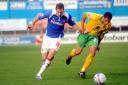 Richard Keogh, left, in typically forceful running action for Carlisle