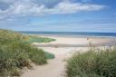 One visitor said Bamburgh Beach 'takes your breath away'