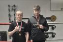 Logan Orr and Maani Campbell with their gold medals from the Denmark tournament