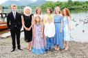 Members of the cast of Swallows and Amazons on the shoreline at Keswick prior to the world premiere