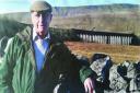 Dr Bill Mitchell in front of the Settle Carlisle line