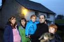 MOVING OUT: Graham Nicholson with his family who fled the rising waters