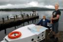 RIGHT: Heiki Hanso (right) and his father Andres with the hire boat they are planning to drive to Estonia.