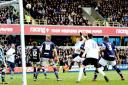 Josh King sees his header come back off the post at the Den