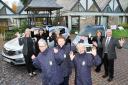 Delighted staff and nurses at St John’s Hospice celebrate the arrival of their new vehicles with Kia dealer Steve Slattery, far right