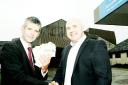 Andrew Thomas  of The Westmorland Gazette (left) gives the coupons to Aaron Cummins, deputy chief executive of the University Hospitals of Morecambe Bay NHS Trust