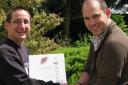 Photograph: Neil Harnott (right), former local biodiversity manager, hands over the BAP to Graham Jackson-Pitt (left), the new local biodiversity manager.