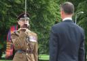 Lieutenant Colonel Gareth Walker of the Royal Engineers receives the sword of peace