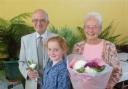 Kerenza Lentell presented flowers to Tony and Joan Jackson as they opened Bolton-le-Sands Horticultural Society's 91st Annual Summer Show