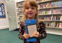WINNER: Thalia receiving her prize at Windermere library last week