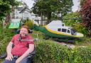 Cumbria County Councillor Will Clark in front of one of the new GNAAS sculptures