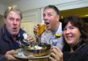 Gerald Fowler, Chris, and Karen Adhead trying out the world's hottest curry.