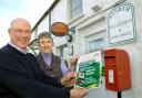 COMMUNITY DELIGHT: Postmaster Rob Crompton and helper Kay Owen with notification that Storth Post Office and Village shop is a finalist in the Best Village Shop/Post Office Award 2010.