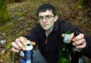 SUSPENDED SENTENCE: John Powell with litter he found in the layby where he staged the spoof axe attack