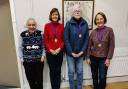 The four committee members celebrated a decade of service this month