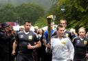 Philip Barker carries the torch in Grasmere.