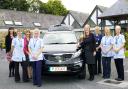 The Hospice at Home team with one of the new vehicles which would be supplied by Rayrigg Motors of Windermere.