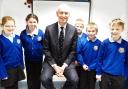 Over Kellet pupils Mia Powell, Laura Fawcett, Harry Yates, Eddie Rae and Alex Armer with Edwin Booth