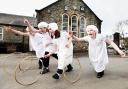 Craven primary pupils Anna Maudsley, Katie Gugeon, Charlotte Stewart and Charlotte Wilson rolling Victorian-style wooden hoops