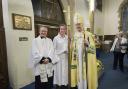 Picture shows the Rev John Davies with crucifer Annie Parker and the Rt Rev Nicholas Baines, Lord Bishop of Leeds.
