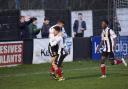 Ben Thomas and Steven Yawson celebrate with Scott Harries after he scored for Kendal