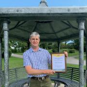 Holgates owner Michael Holgate with the AA accolade at the memorial pagoda to his late father, Frank