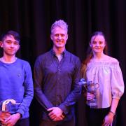 Dan Purcell, centre, with Sam McSherry and Lucy Satterthwaite who collected house cups on behalf of fellow pupils