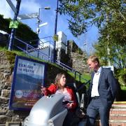 Tim Farron and Staveley resident Clare Hale outside Staveley railway station