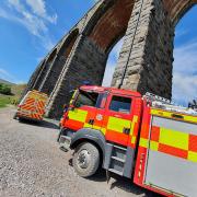 Trains stopped as fire crews tackle track fire