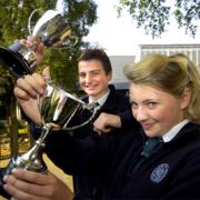 UP FOR THE CUP: Pupils Bethany Duckett and Marcus Nicholson ready for the QES annual awards ceremony.