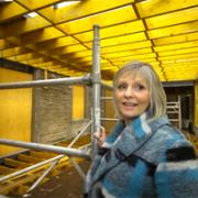 WORK TIME: Linda Graves in the partially built new extension
