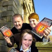 New York Times best selling author GP Taylor with Sedbergh pupil's Anna Walkden and Ben Hunt.