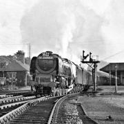 The station as it was in the late 1950s with a steam train pulling out