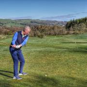 New club captain John Sherlock drives off using a ceremonial hickory-shafted club at Kirkby Lonsdale Golf Club