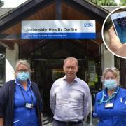 The South Lakes MP outside Ambleside surgery with district nurses