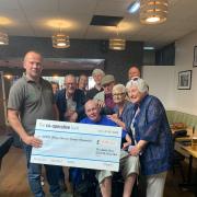 Ian Price with members of White Hart Sports and Social Club.