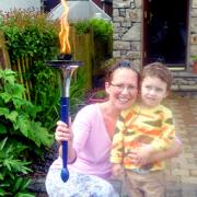 EXCITED: Taking an opportunity to shine a torch for the London Olympics in 2012 in her garden is Kendal mum Amanda Oversby and her son Grayson