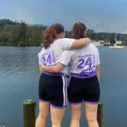 Molly Conway and Daniella Flemons taking in their achievement by Windermere Lake