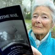 MOVING BOOK: June Tower with a copy of her book Maritime Mail, which tells of her ‘secret’ love for a sailor with doomed submarine HMS Affray