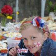 Eight-year-old Molly Wilcock tucks into the food at the Bouth celebrations