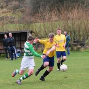 Kendal United (yellow) on the attack against their town rivals Celtic (green and white). Picture by Richard Edmondson