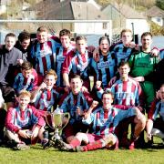 Kendal County celebrate after two injury time goals pinched the Westmorland Senior Challenge Trophy from Keswick