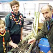 Former district chairman Norman Dray, who had the winning layout at the Scout Rail Fair in Settle, with Tom Lothian and William Arber from Settle Scouts and Cubs