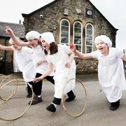 Craven primary pupils Anna Maudsley, Katie Gugeon, Charlotte Stewart and Charlotte Wilson rolling Victorian-style wooden hoops