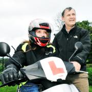 Asher Hamilton on her scooter with Pete Armitage of Inspira