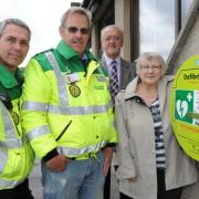 Pictured with the new life-saver are (left to right) Kerry Stafford-Roberts, community first responder trainer, first responder Martin Smith, parish council chairman Roy Fry and clerk to the parish council Ann Park