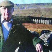 Dr Bill Mitchell in front of the Settle Carlisle line